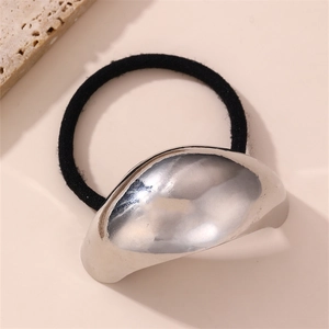 Detail of minimalist metallic silver hair tie with high-elastic black rubber band