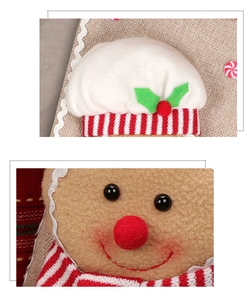 Detailed view of handmade gingerbread man plush ornament with festive knitting texture