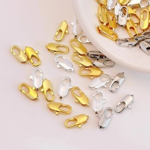 Detailed macro shot of gold and silver lobster clasps for DIY jewelry making