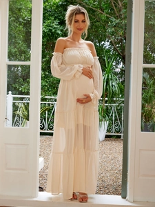 Elegant beige off-shoulder maternity maxi dress with ruffle detailing for summer vacations