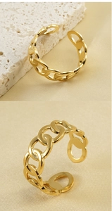 Detailed macro view of 18k gold plated adjustable chain ring on a minimalist background