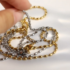 Minimalist stainless steel rice bead necklace in gold and silver finishes