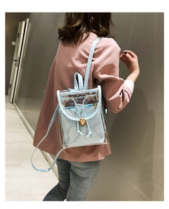 Detail of light blue transparent PVC backpack with inner pouch and gold clasp on a model