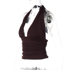 Detail view of the side profile on a brown halter V-neck top with elastic ruching details