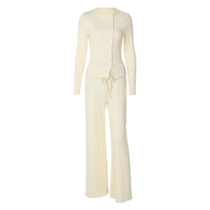 Detailed view of cream ribbed knit tracksuit set with side buttons and wide leg pants