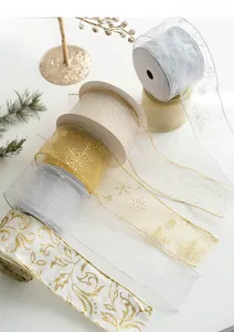 Detailed view of gold and silver Christmas ribbons with snowflake embroidery and floral patterns