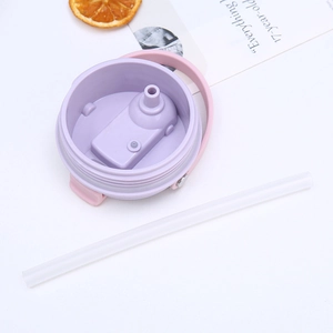 Detail view of the 30oz tumbler lid assembly with purple inner cap and clear straw