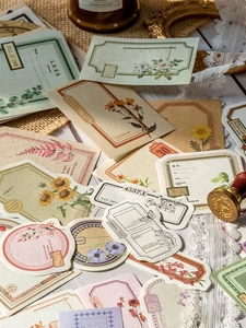 Detail of vintage scrapbooking stickers with botanical patterns and antique textures