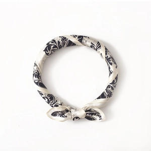 Elegant mulberry silk square scarf featuring black and beige floral scroll patterns