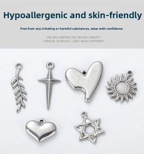 Polished stainless steel charms featuring cross, sun, leaf, heart, and star designs