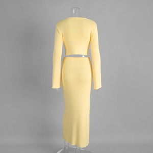 Detail of light yellow knit set showing ribbed texture and back view of long skirt