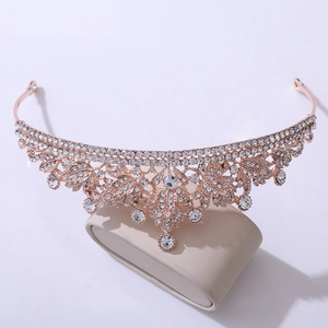 Detailed view of rose gold bridal crown with leaf design and sparkling rhinestones