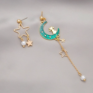 Asymmetric cat and moon earrings with gold stars and long tassel fringe detailing
