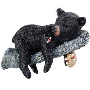 Garden black bear resin ornament sleeping on tree branch with decorative beehive and bees