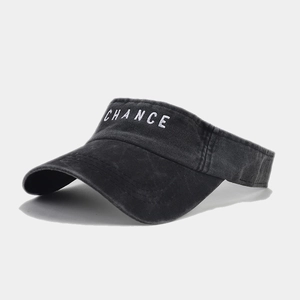 Close-up of white CHANCE embroidery on a black washed denim visor for outdoor sun protection