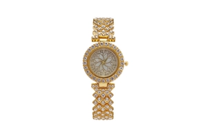 Close-up of gold ladies watch with floral crystal dial and rhinestone-encrusted metal strap
