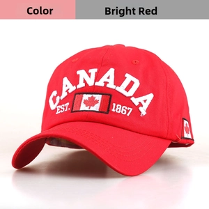 Close-up of red cotton baseball cap with white Canada embroidery and flag detail