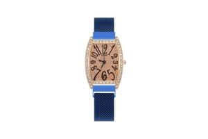 Detail of rose gold tonneau watch case with pavé diamonds and blue milanese mesh band