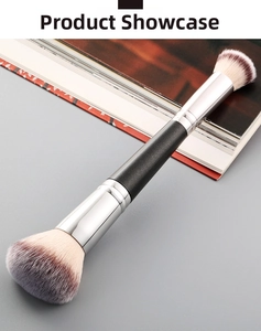 Close-up of double-ended makeup brush with black handle and silver ferrules