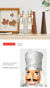 Close-up of hand-painted wooden nutcracker king figures with glitter details and crown
