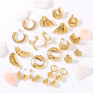 Collection of gold titanium steel earrings in various geometric shapes on white background