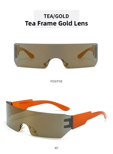 Detail view of Y2K style one-piece orange temple sunglasses with gold tea lenses
