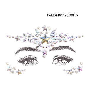 Detailed view of AB star gems and pearls as face and body jewels on clear backing