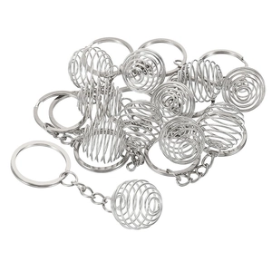 Macro shot of silver spiral bead cages and keychains for holding crystal stones