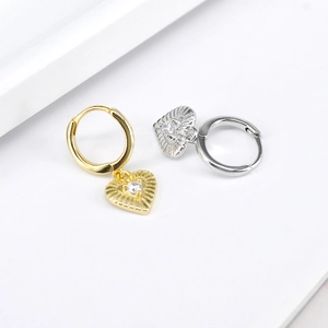 Luxurious S925 heart earrings with starburst texture and central zircon in gold and silver