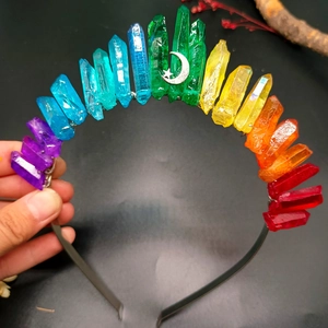 Detailed view of raw rainbow crystals headband with silver moon and star accents