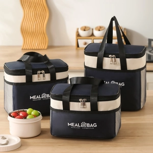 Three sizes of insulated navy and beige lunch bags with foil lining and mesh side pockets