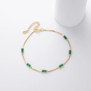 Elegant 925 sterling silver gold plated bracelet with rectangular green emerald stones