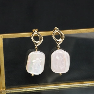 Elegant gold baroque freshwater pearl earrings featuring irregular rectangular shapes