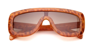 Detail of tortoiseshell frame sunglasses showing hand polish text and size markings