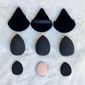 Detail of 9-piece makeup sponge set featuring black velvet puffs and teardrop blenders