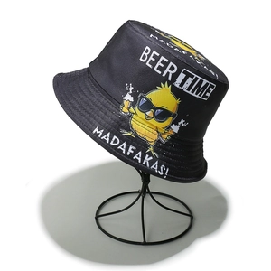 Detail of black canvas bucket hat with yellow duck print and Beer Time text