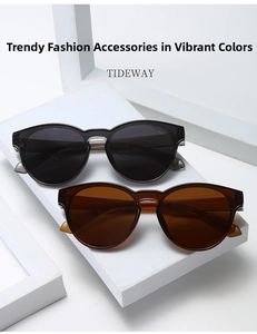 Detail of classic black and transparent tea sunglasses with durable metal hinges