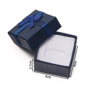 Detail of navy paper jewelry box 4x4x2.7cm with ribbon bow and foam insert for rings