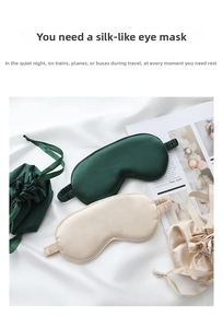 Close-up of silk sleep mask set including drawstring bag in dark green and beige colors