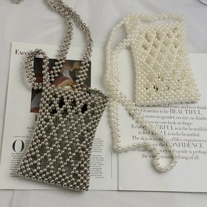 Handmade beaded crossbody phone bags in silver and pearl white with diamond hollow pattern