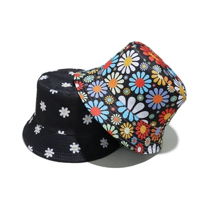 Women's black cotton bucket hats with classic white and colorful daisy floral patterns
