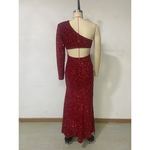 Detail of red sequin evening gown with single shoulder and open back cutout design