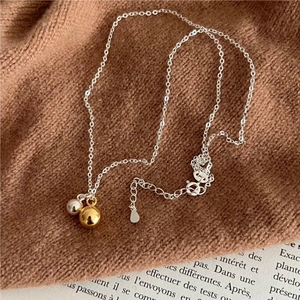 Minimalist S925 silver necklace featuring double round bead pendants on a fine link chain