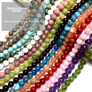 Detailed rows of colorful polished natural stone round beads for DIY jewelry