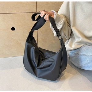 Large capacity black nylon dumpling crossbody bag with adjustable strap and metal zipper