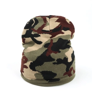 Detail of knitted beanie showing camouflage pattern and thick ribbed cuff texture