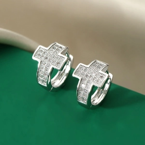 Silver cross huggie hoop earrings with sparkling micro-pave zircons for women