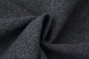 Detailed view of high-quality dark gray wool fabric texture and soft drape