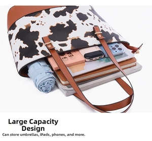Macro view of spacious cow print tote bag showing storage for iPad, umbrella and daily essentials