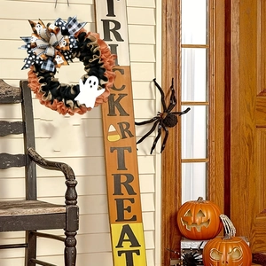 Halloween wreath with orange pumpkin, ghost ribbon, and BOO bow for front door decor